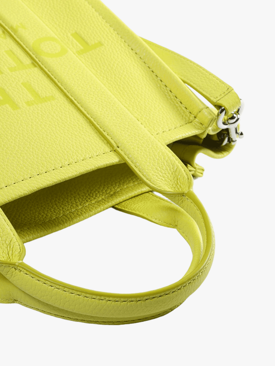 Close up of the green bag, showing texture of the leather fabric