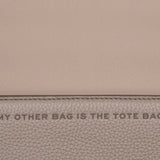 Close up of tan bags, showing texture of the cow leather fabric