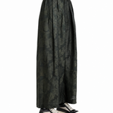 Green pants worn by a person, showing the pants fit