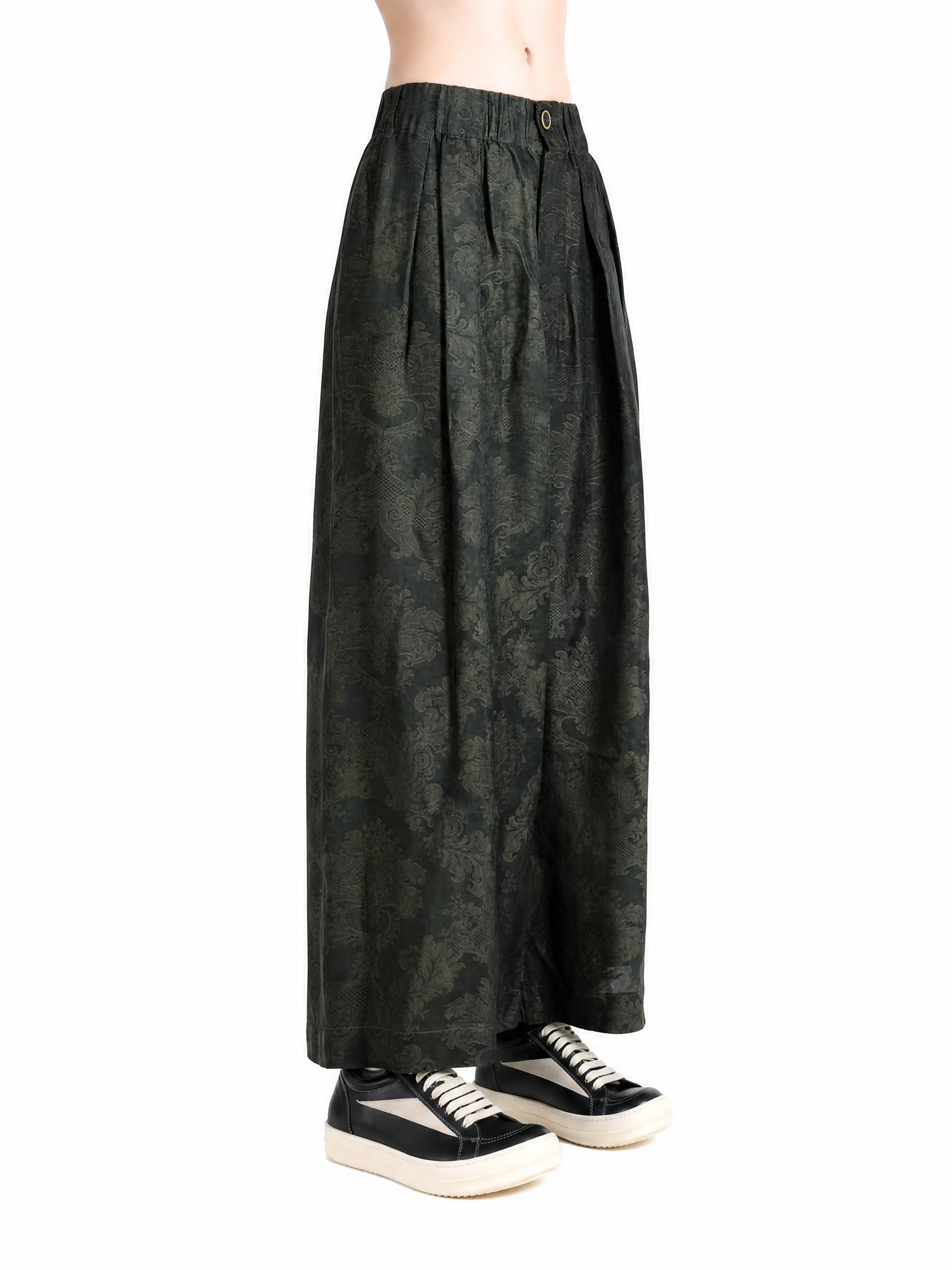 Green pants worn by a person, showing the pants fit