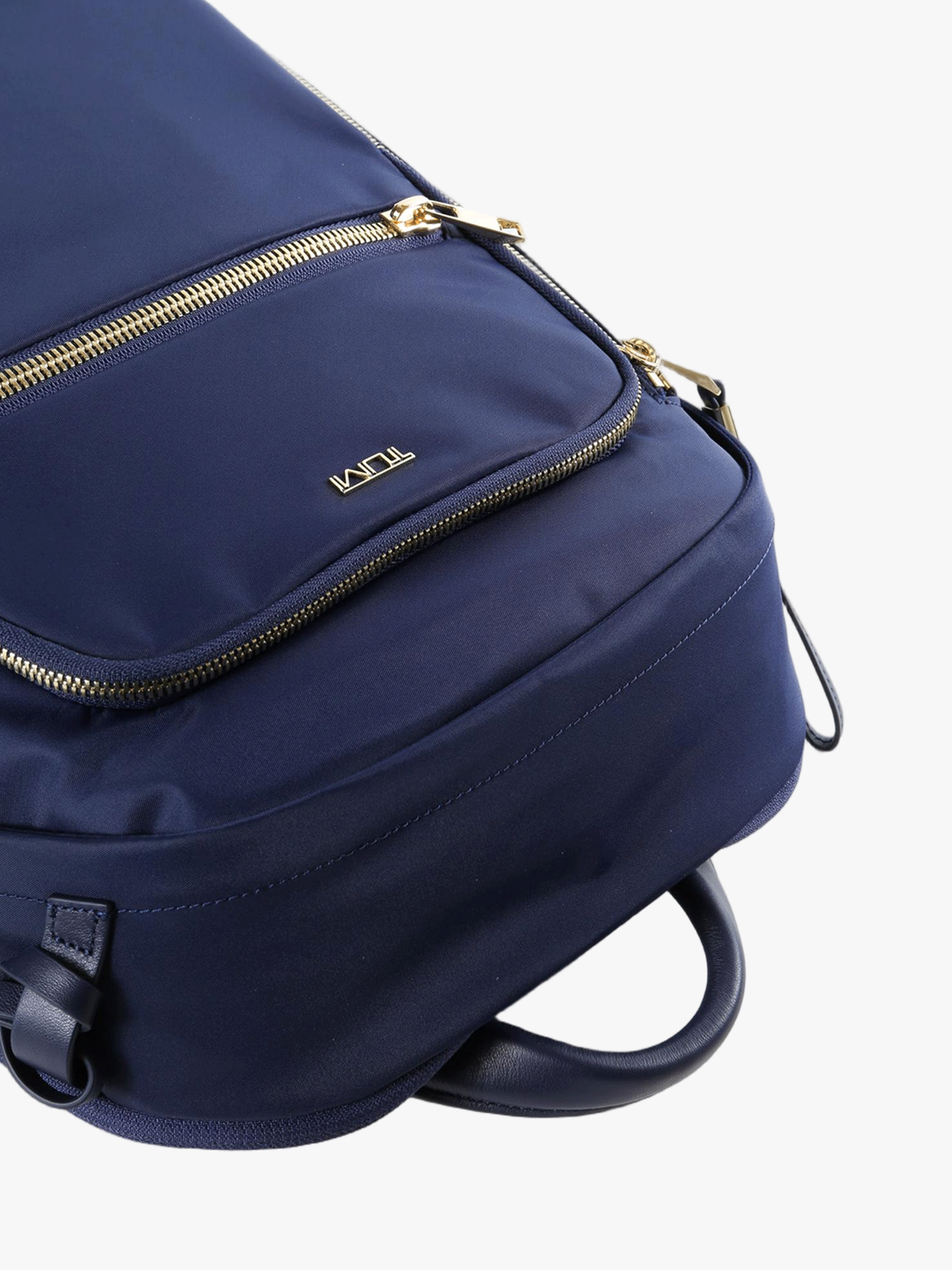 Close up of navy backpack, showing texture of the nylon fabric