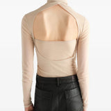 Tan top worn by a person, showing the top fit