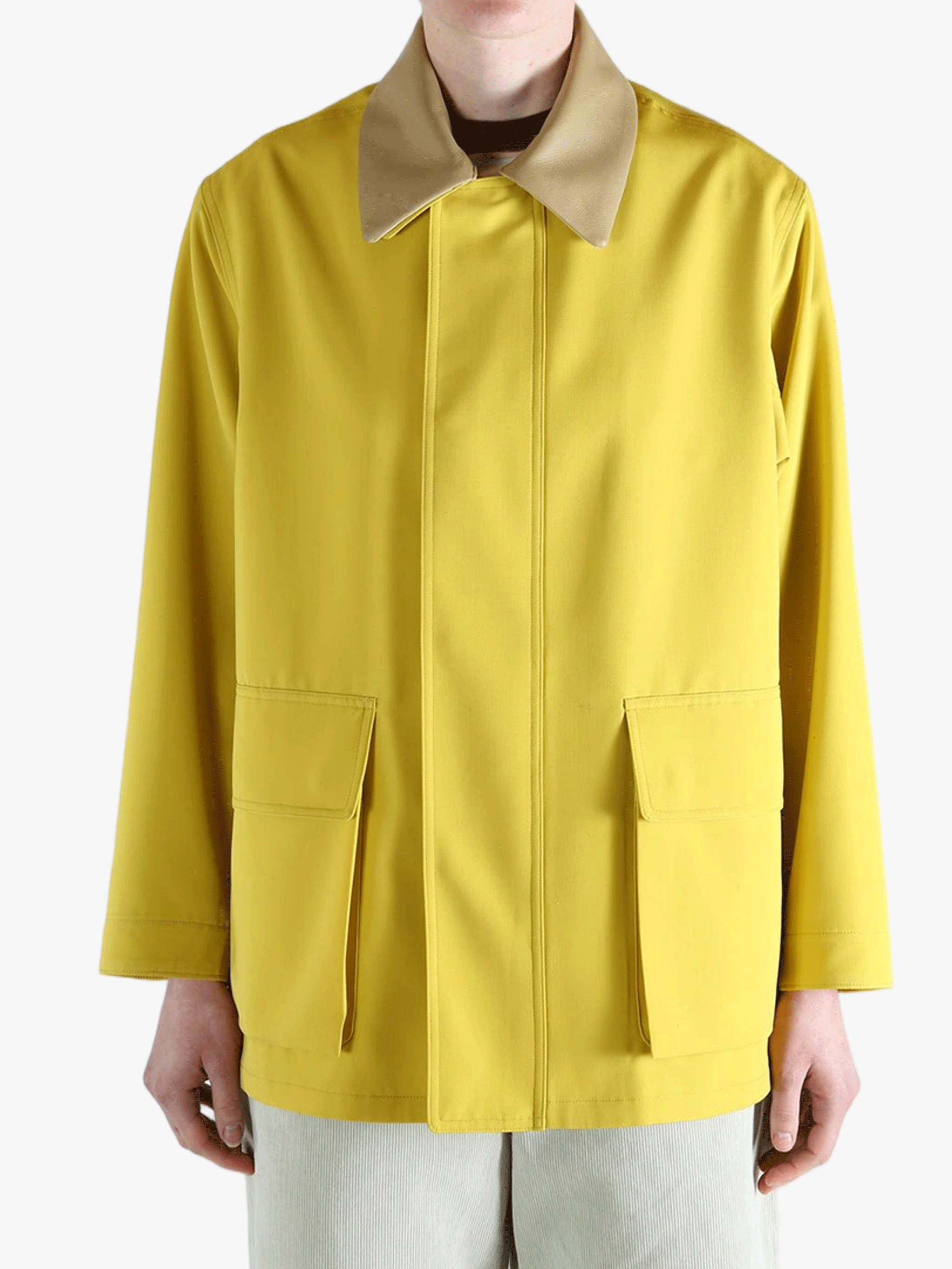 Yellow jacket worn by a person, showing the jacket's fit