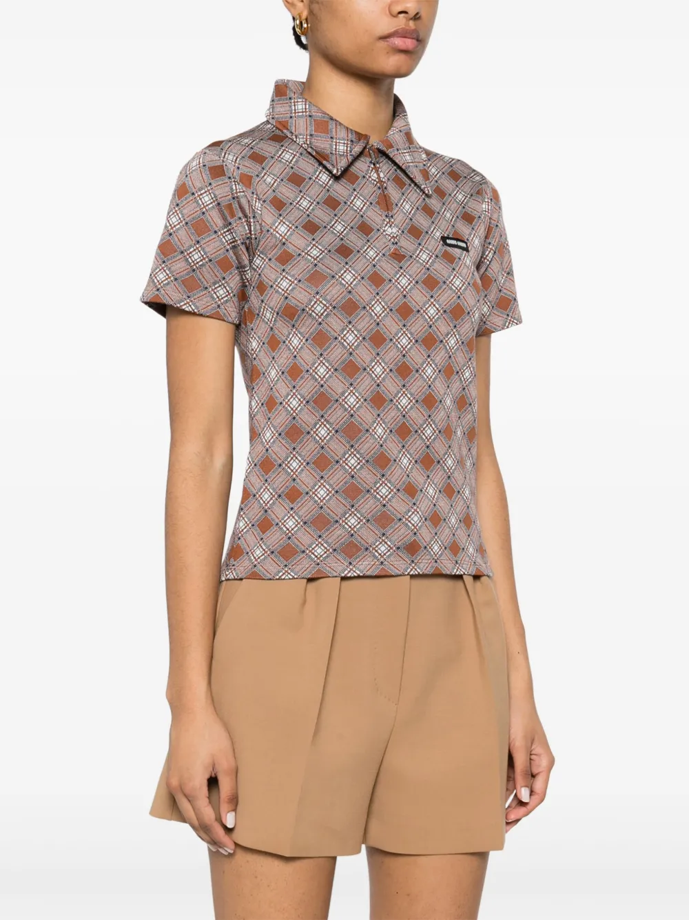 Brown shirt worn by a person, showing the shirt's fit