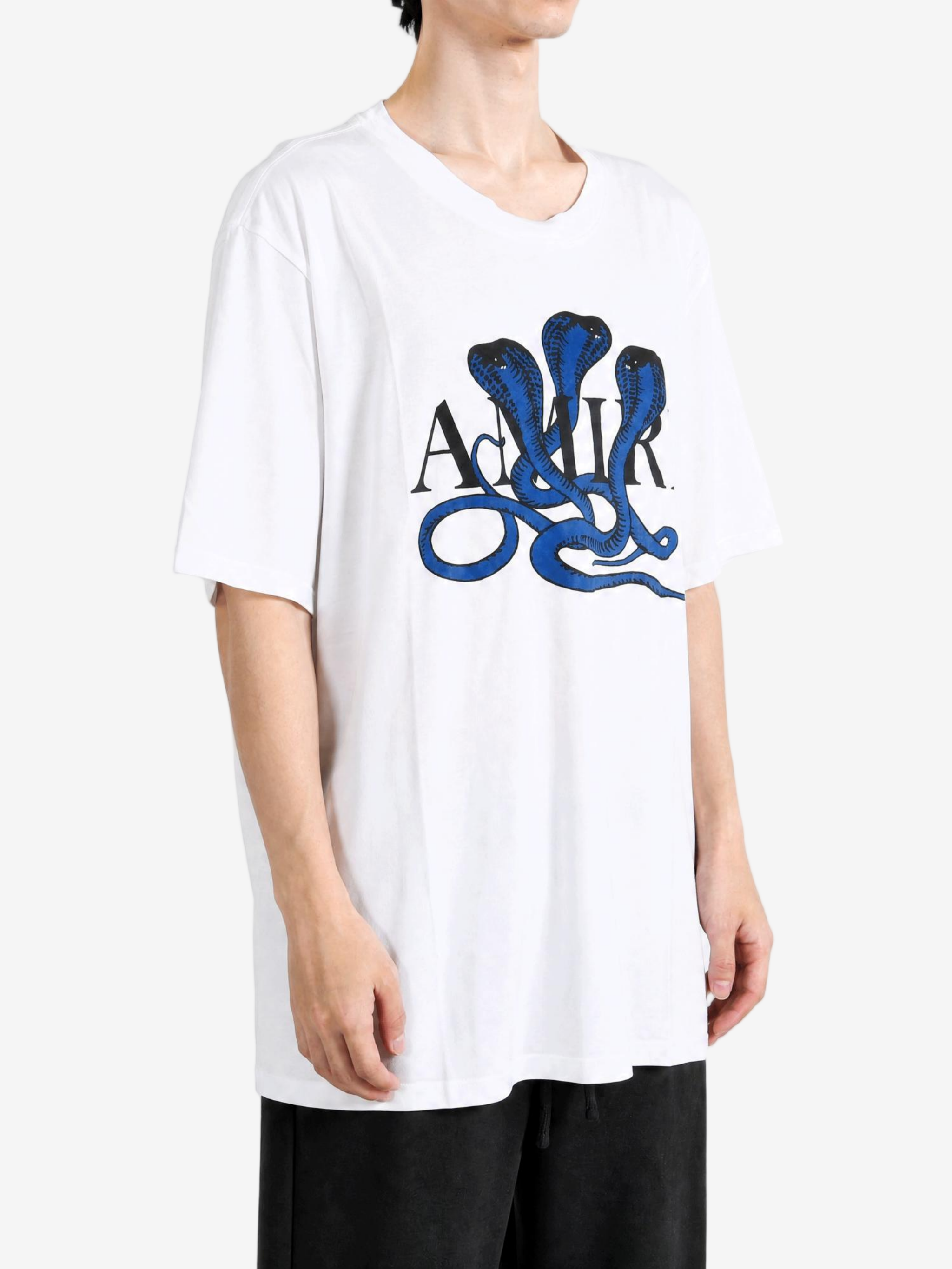 White t-shirt worn by a person, showing the t-shirt fit