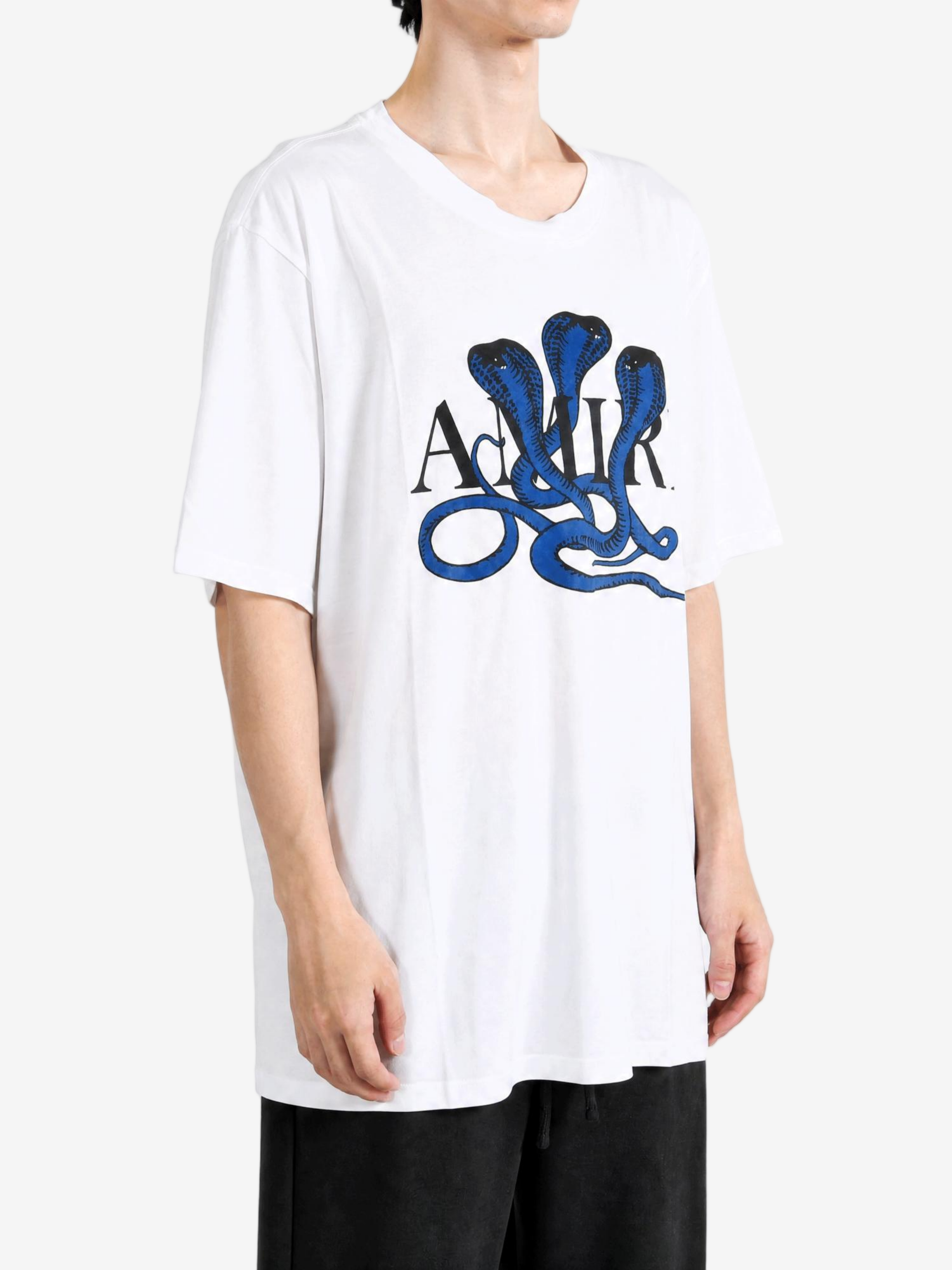 White t-shirt worn by a person, showing the t-shirt fit