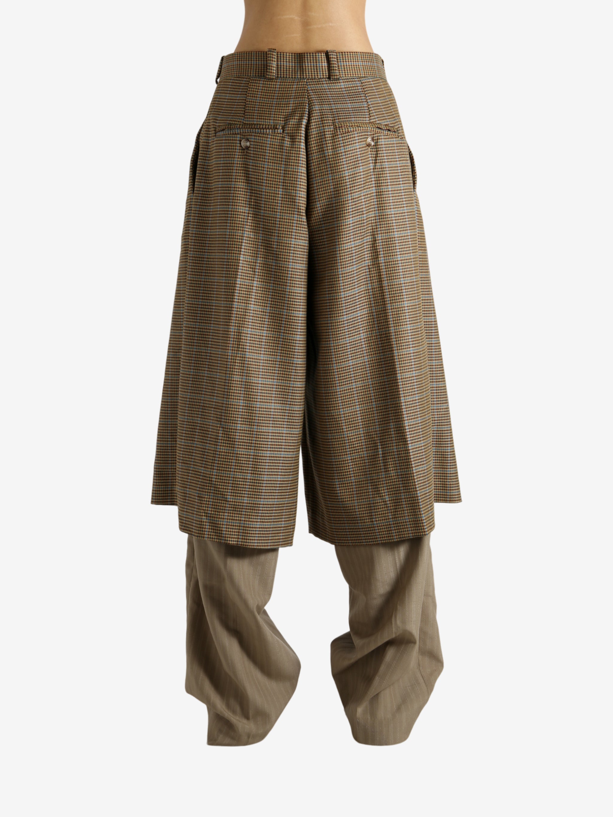 Brown pants worn by a person, showing the pants' fit