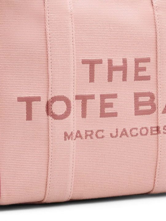 Close up of the pink bag, showing texture of the cotton fabric
