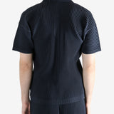 Navy shirt worn by a person, showing the shirt's fit