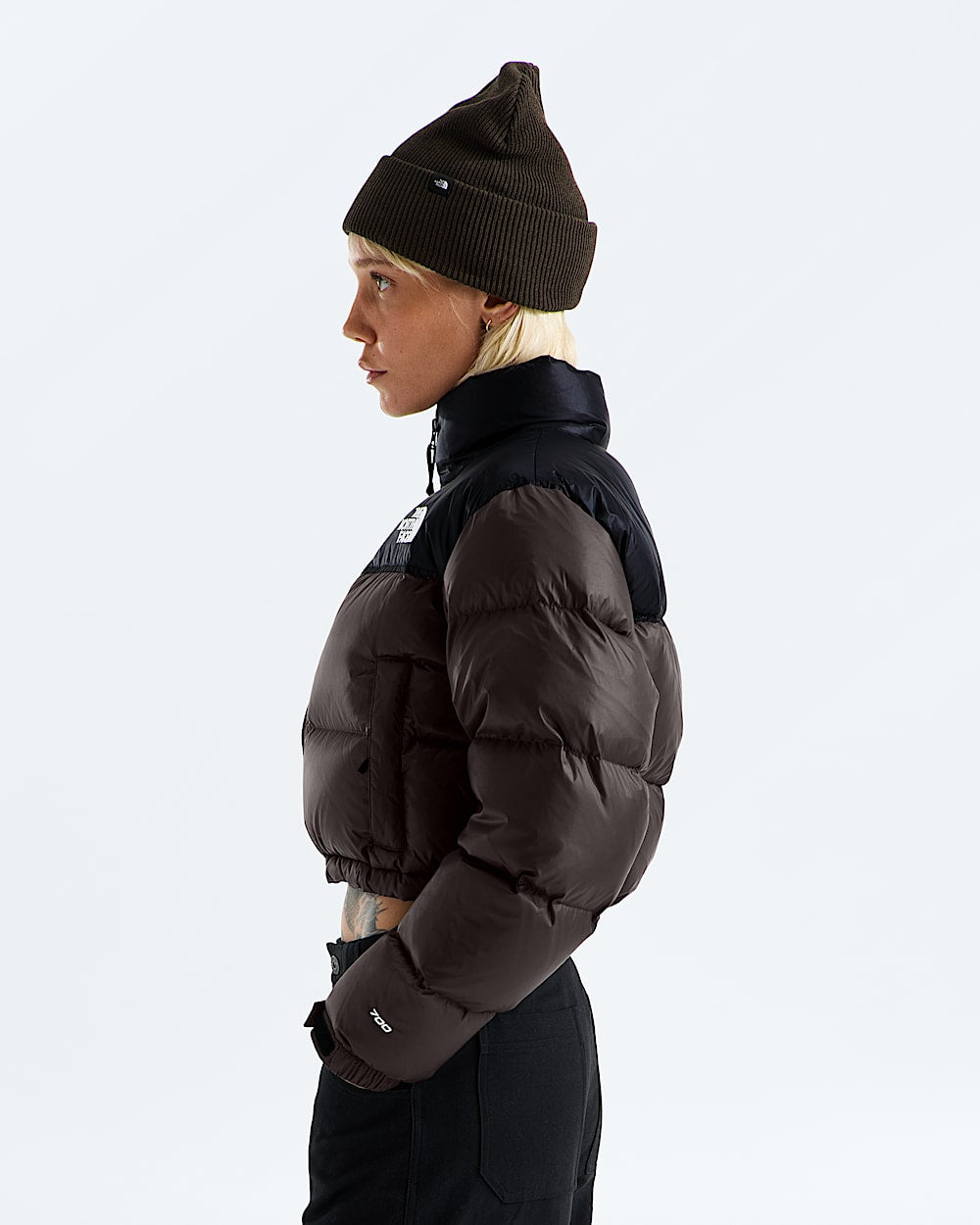 Brown jacket worn by a person, showing the jacket fit