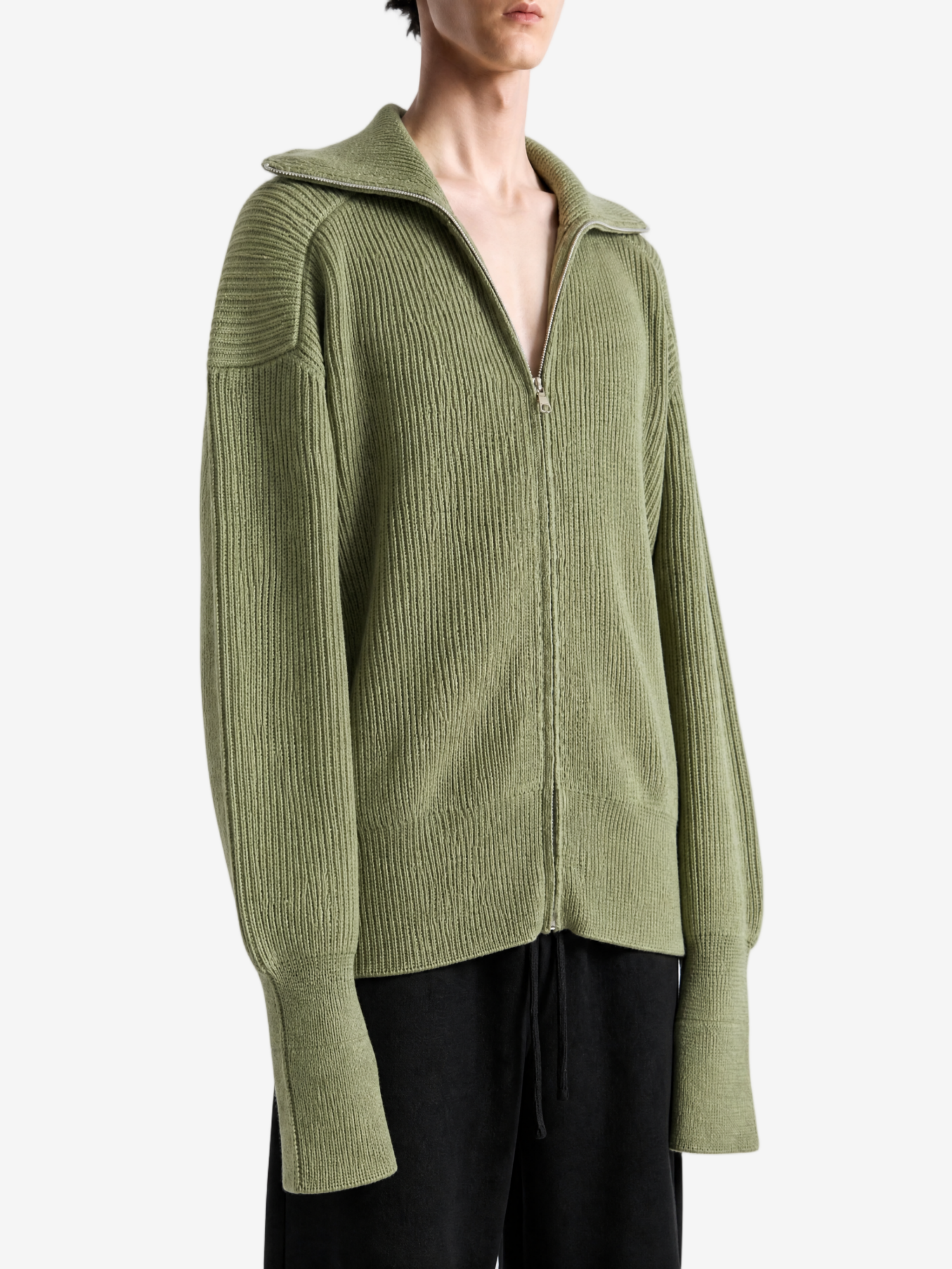 Green top worn by a person, showing the top fit