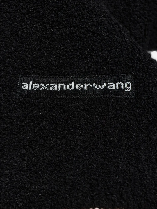 Close up of black hoodie, showing texture of the Polyester fabric