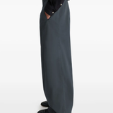 Grey pants worn by a person, showing the pants fit