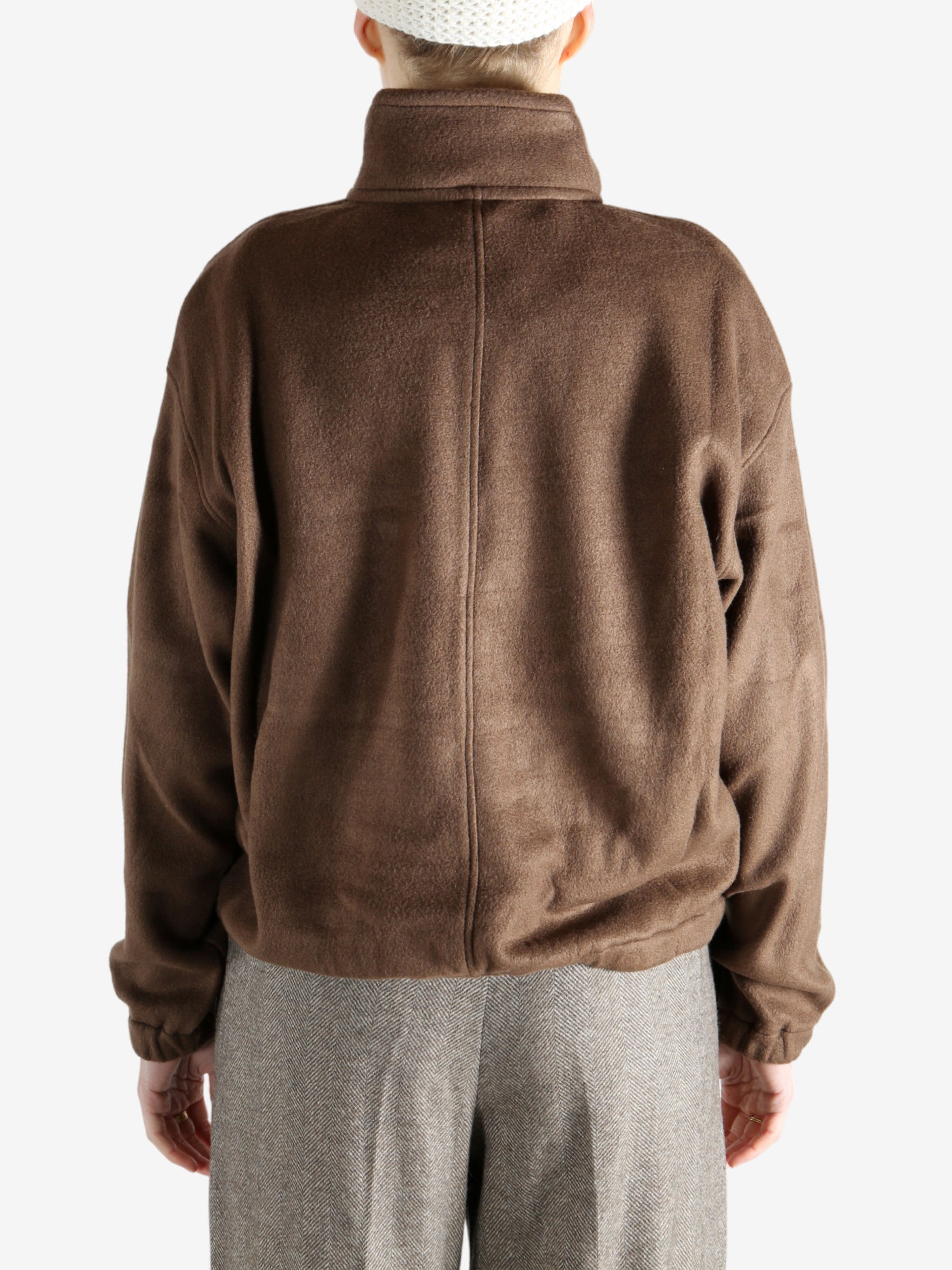 Brown jackets worn by a person, showing the jackets fit