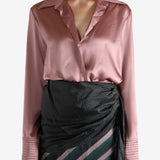 Pink shirt worn by a person, showing the shirt's fit