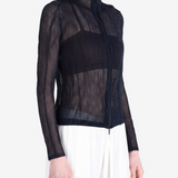 Black shirt worn by a person, showing the shirt fit