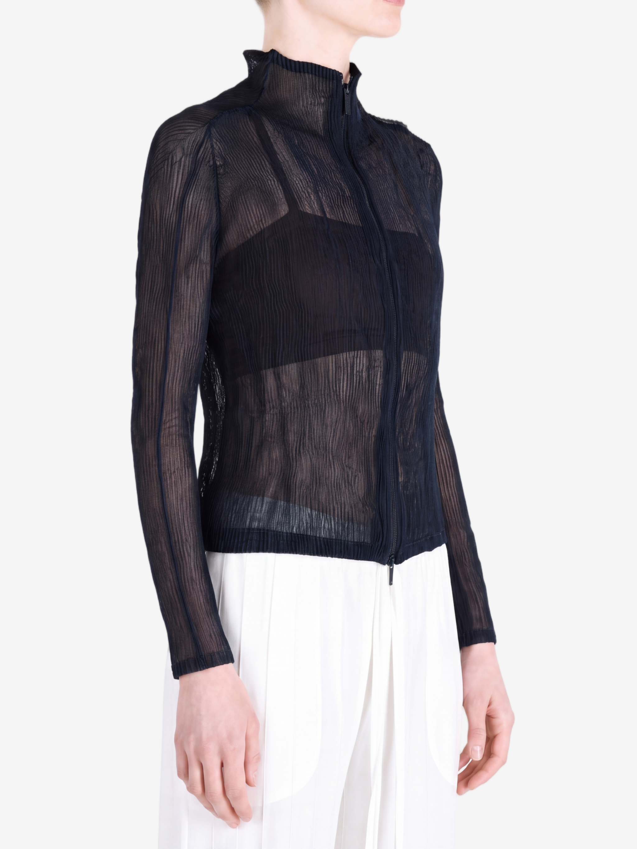 Black shirt worn by a person, showing the shirt fit