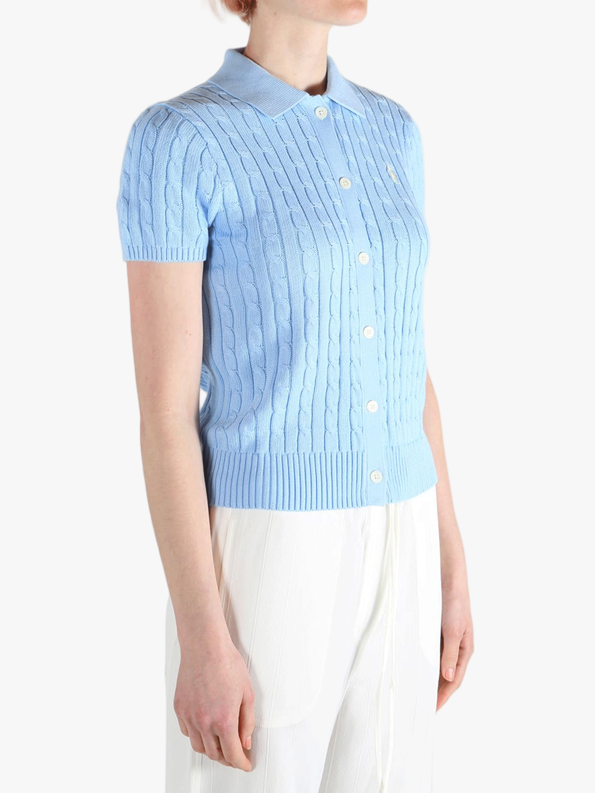 Blue cardigan worn by a person, showing the cardigan's fit