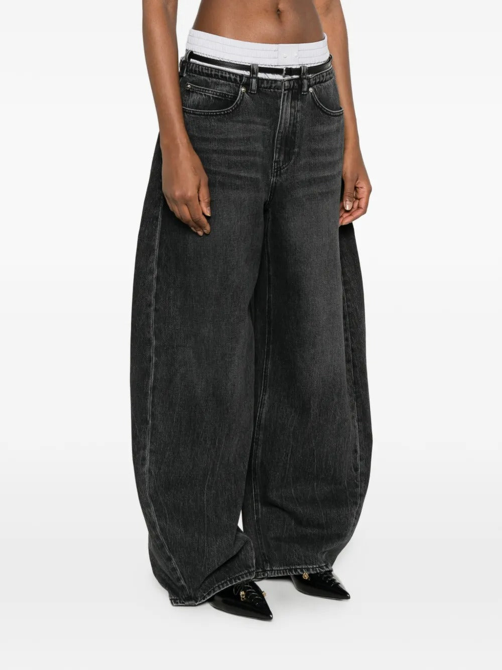 Grey jeans worn by a person, showing the jeans fit