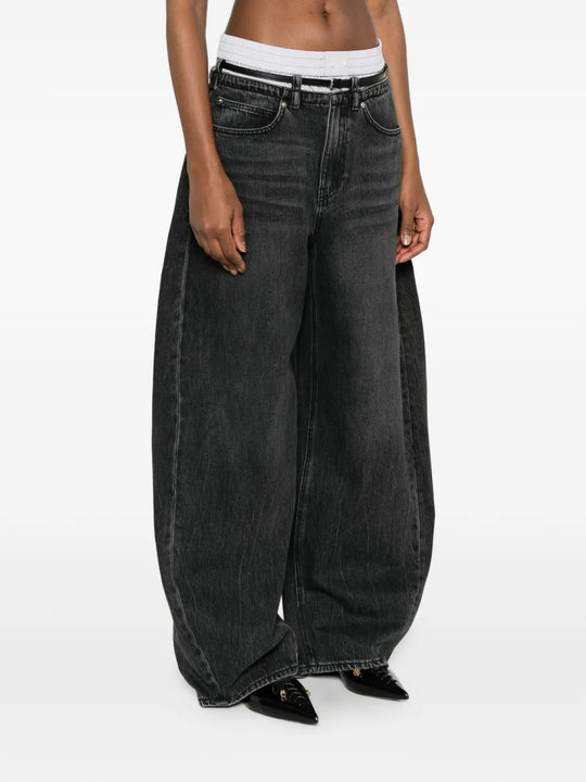 Grey jeans worn by a person, showing the jeans fit