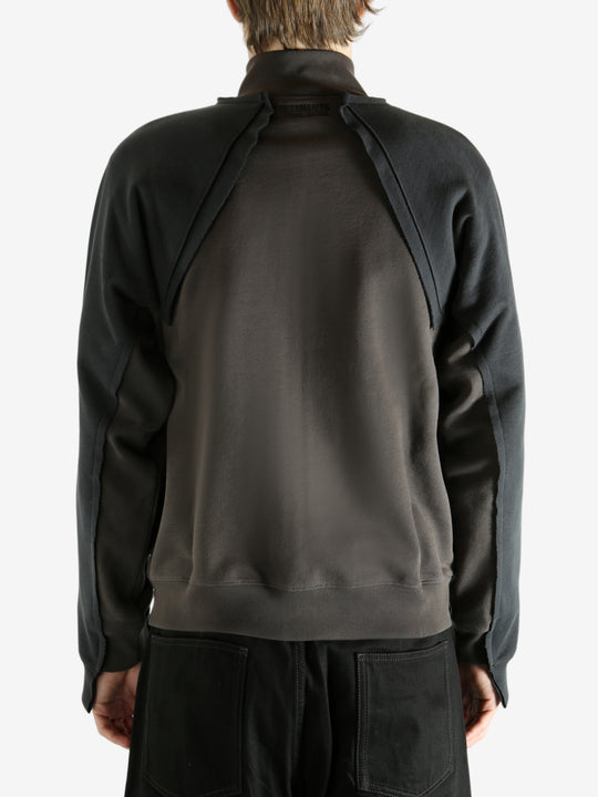 Brown jacket worn by a person, showing the jacket's fit