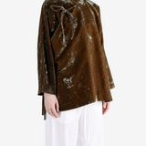 Brown jacket worn by a person, showing the jacket fit