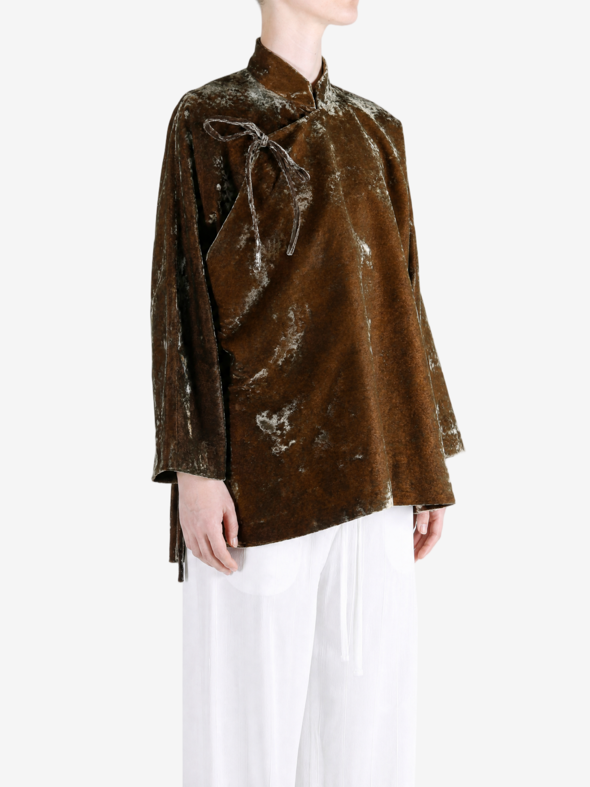 Brown jacket worn by a person, showing the jacket fit