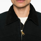 Black jacket worn by a person, showing the jacket fit
