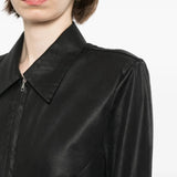 Black shirt worn by a person, showing the shirt fit