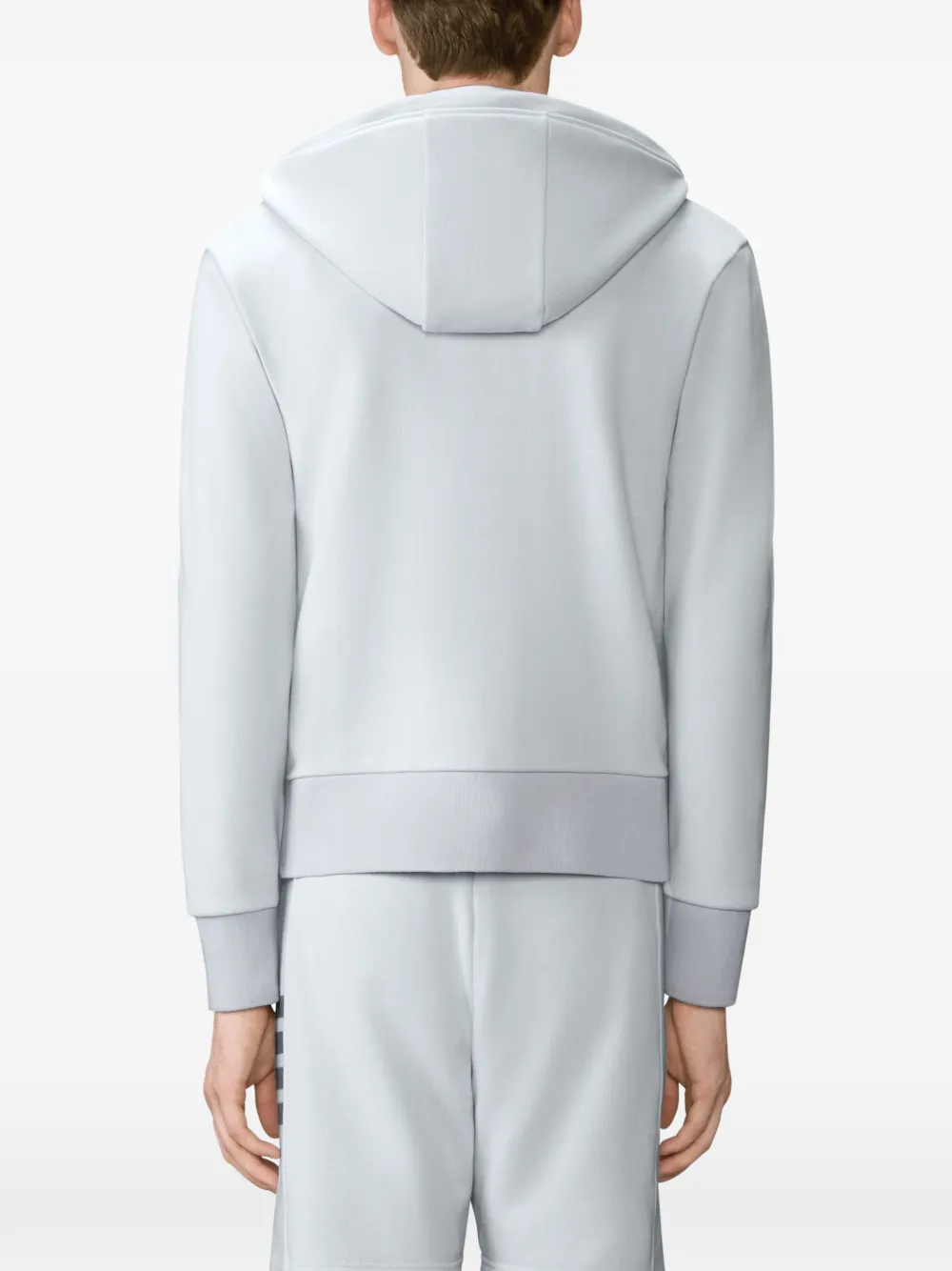 White t-shirt worn by a person, showing the t-shirt fit