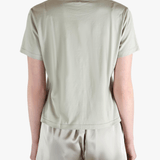 Grey t-shirt worn by a person, showing the shirt's fit