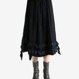 Black skirt worn by a person, showing the skirt's fit