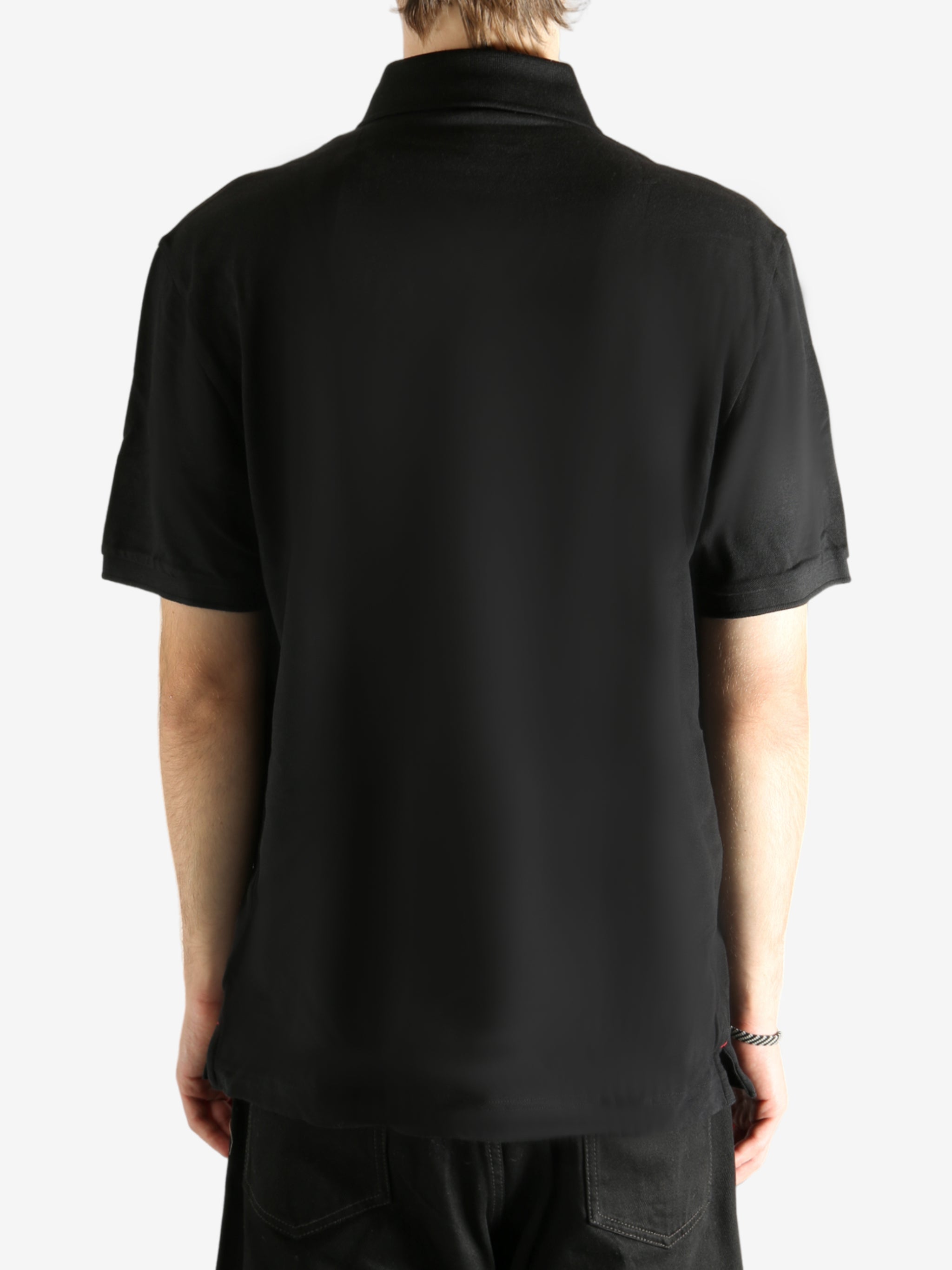 Black T-shirt  worn by a person, showing the T-shirt's fit
