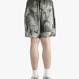 Green shorts worn by a person, showing the shorts's fit