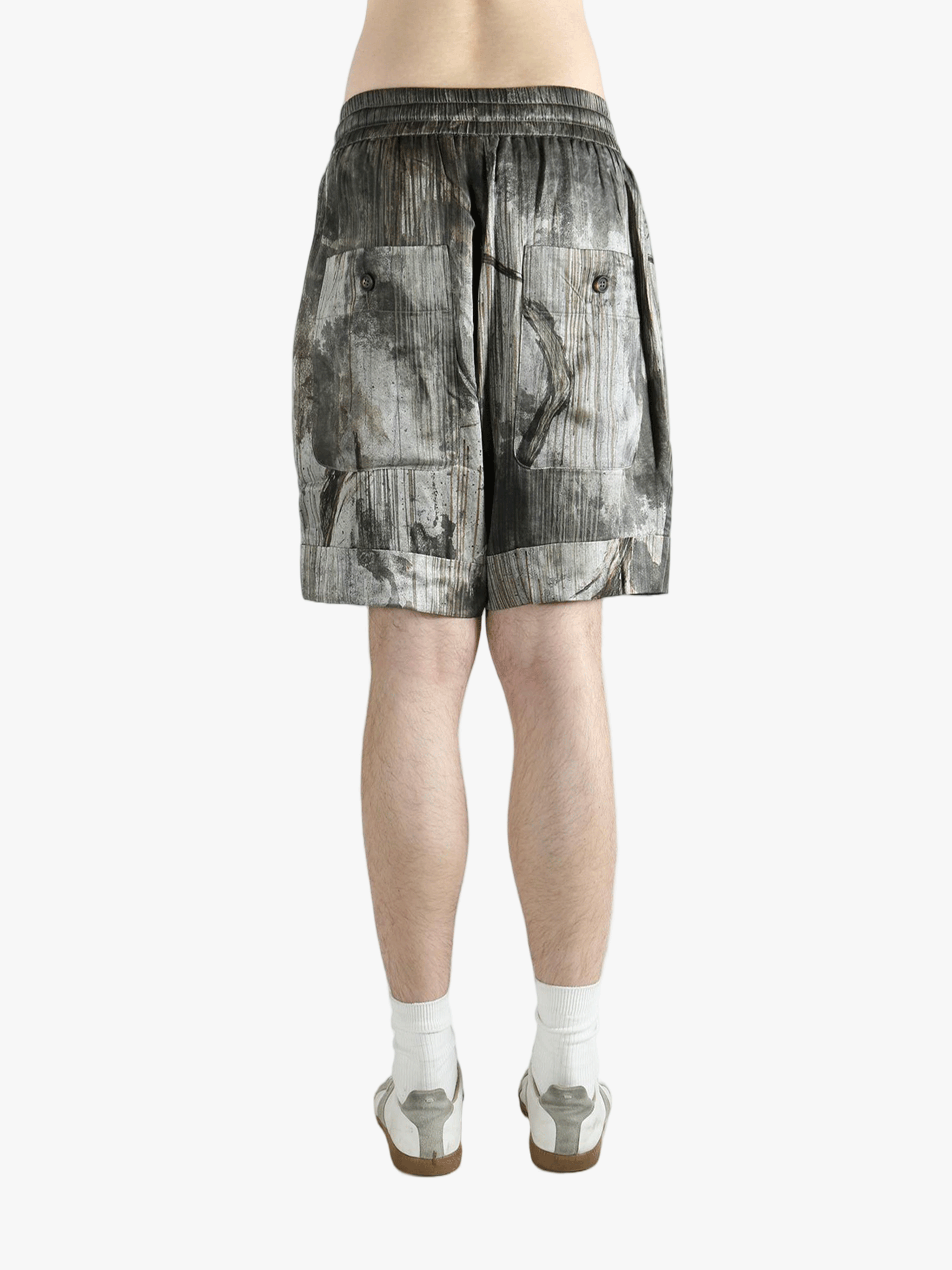 Green shorts worn by a person, showing the shorts's fit