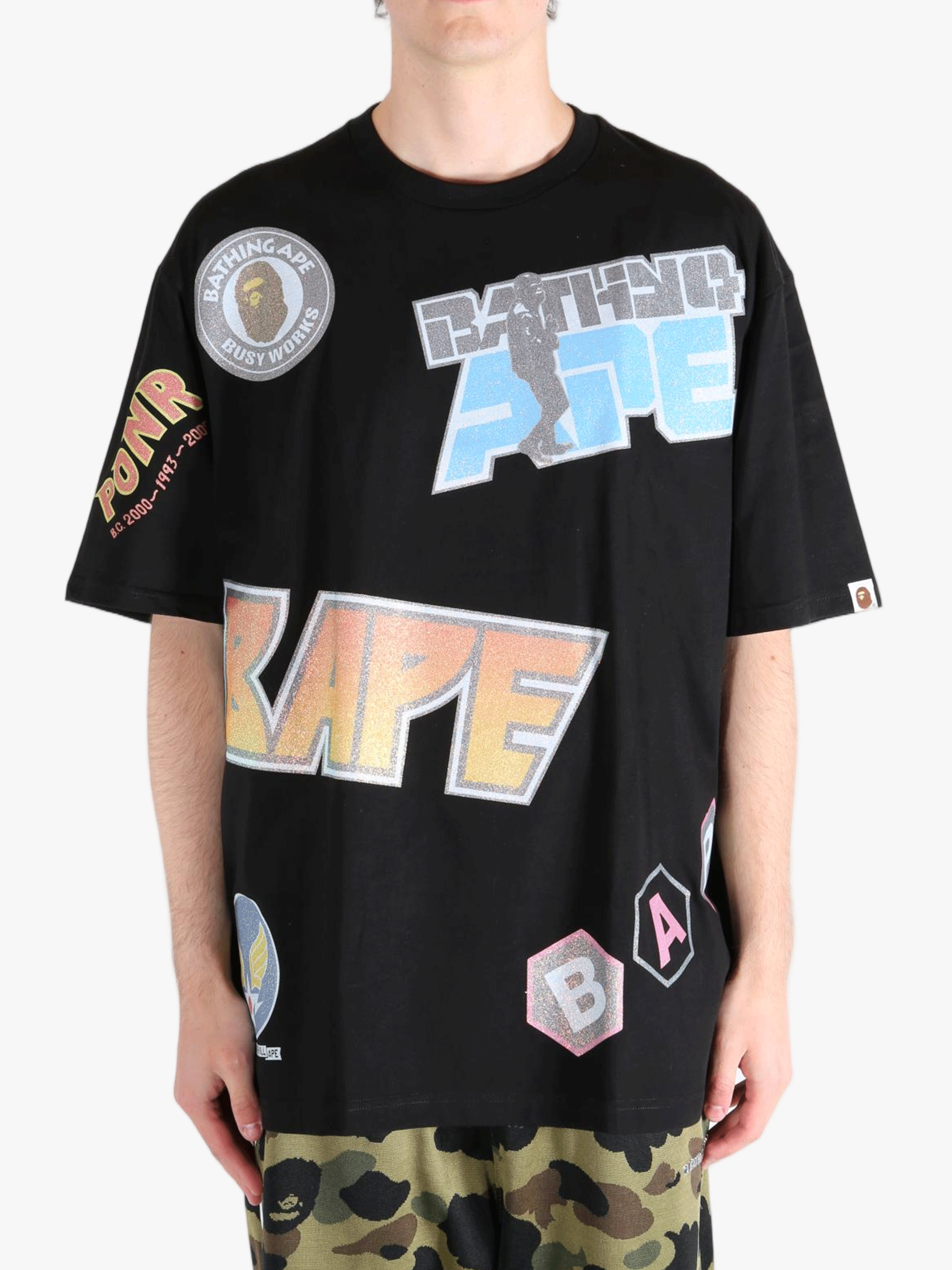 Black t-shirt worn by a person, showing the shirt's fit