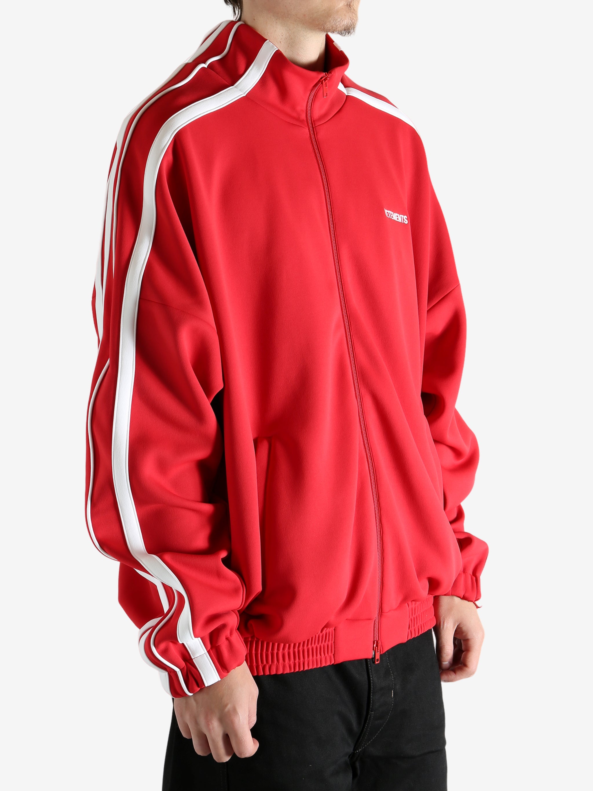 Red jacket worn by a person, showing the jacket's fit