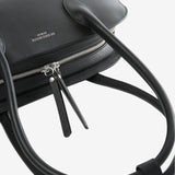 Close up of black bag, showing texture of the calf leather fabric