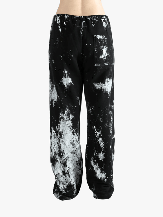 Black pants worn by a person, showing the pants' fit