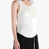 White top worn by a person, showing the top's fit