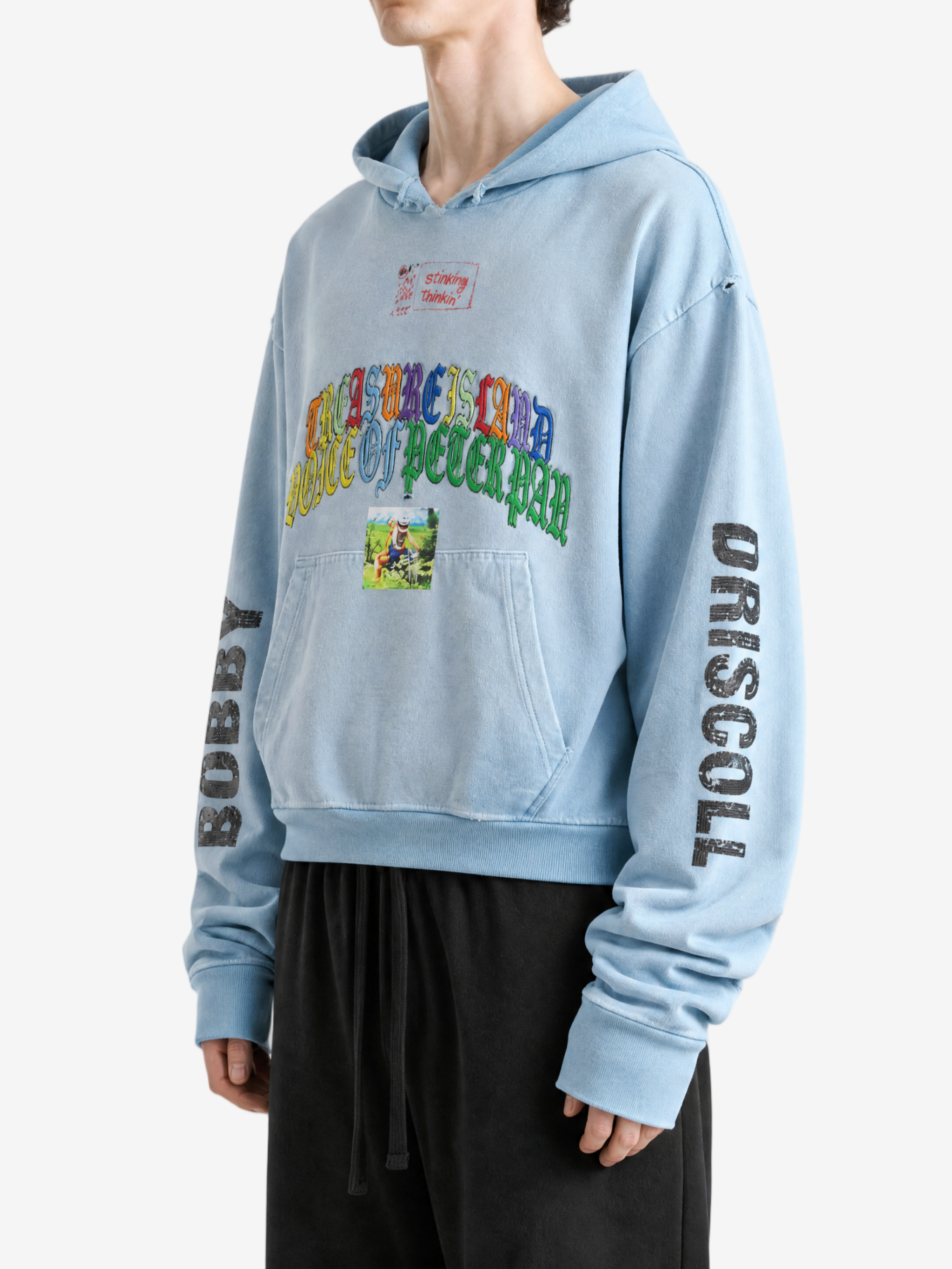 Blue hoodie worn by a person, showing the hoodie fit