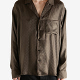 Brown shirt worn by a person, showing the shirt's fit