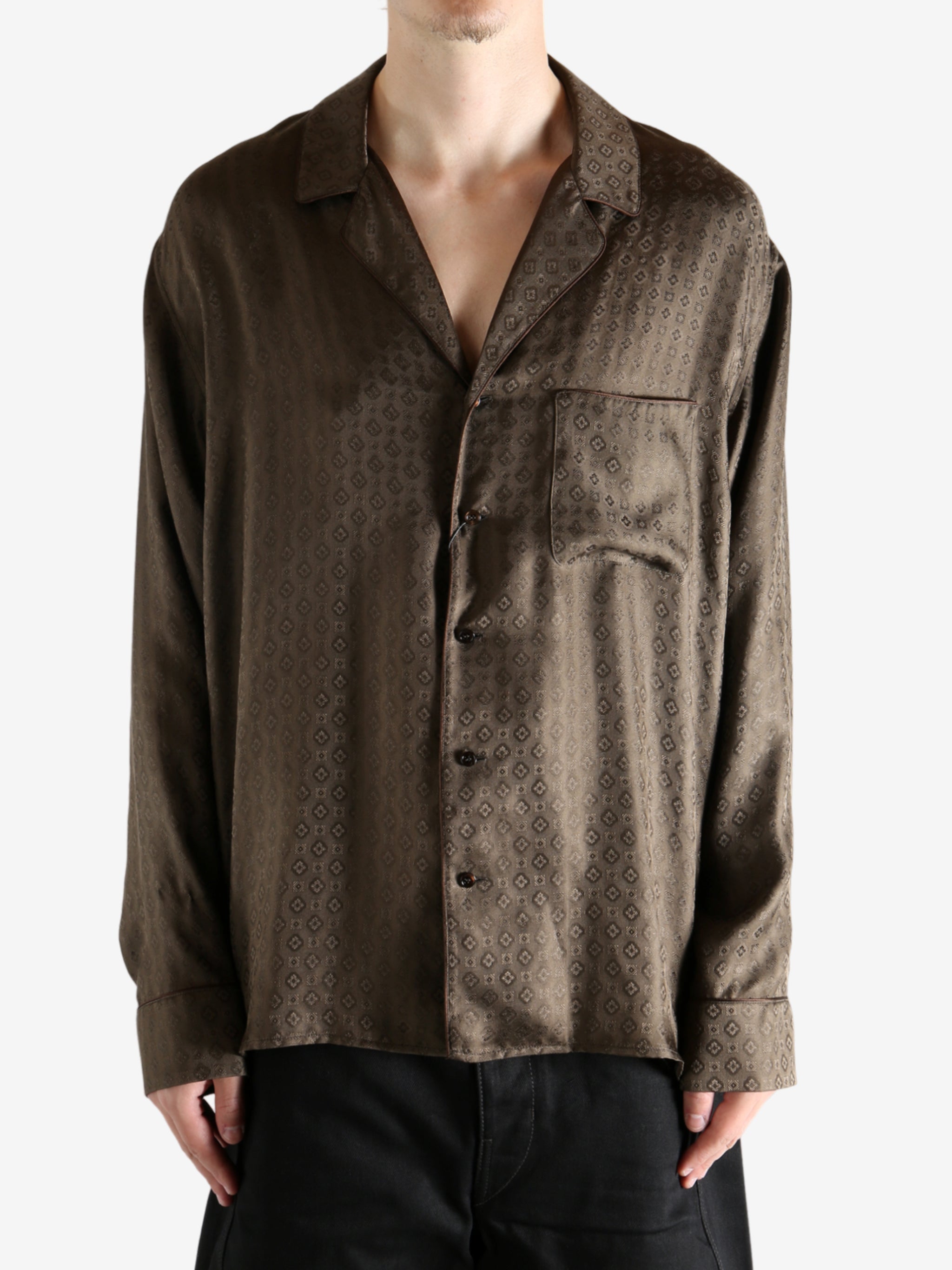 Brown shirt worn by a person, showing the shirt's fit