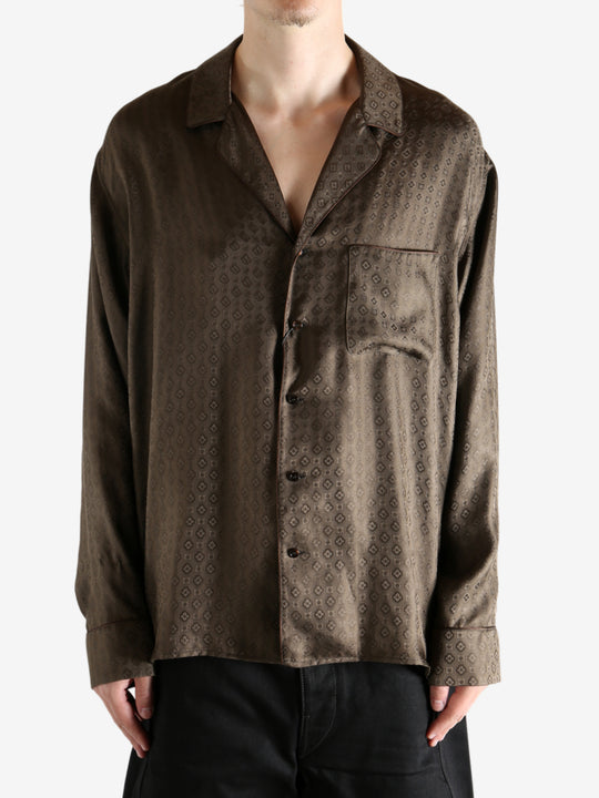 Brown shirt worn by a person, showing the shirt's fit