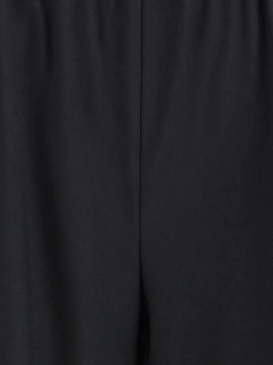 Close up of black pants, showing texture of the virgin wool fabric