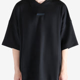 Black t-shirt worn by a person, showing the t-shirt's fit