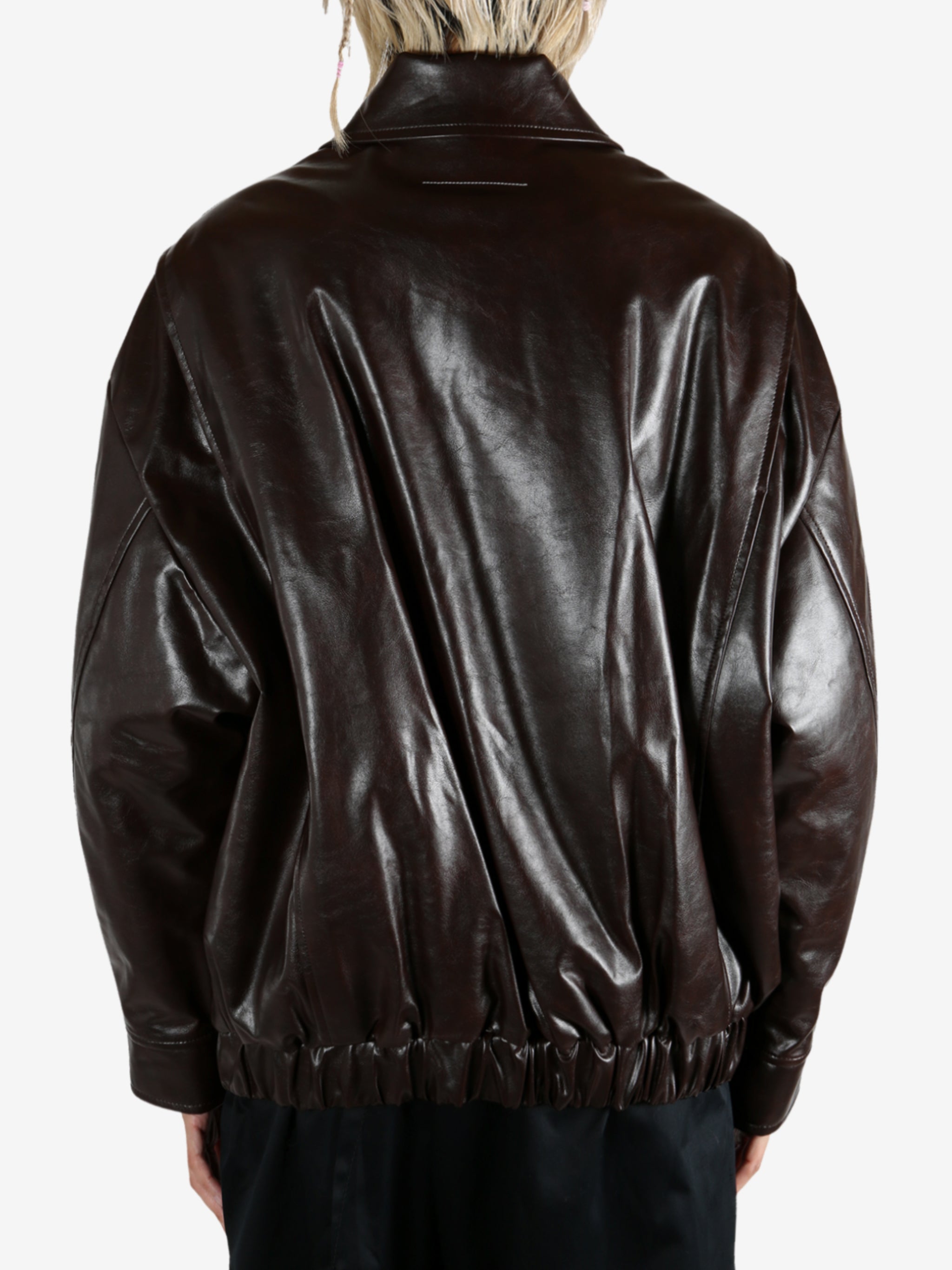 Brown jacket worn by a person, showing the jacket fit