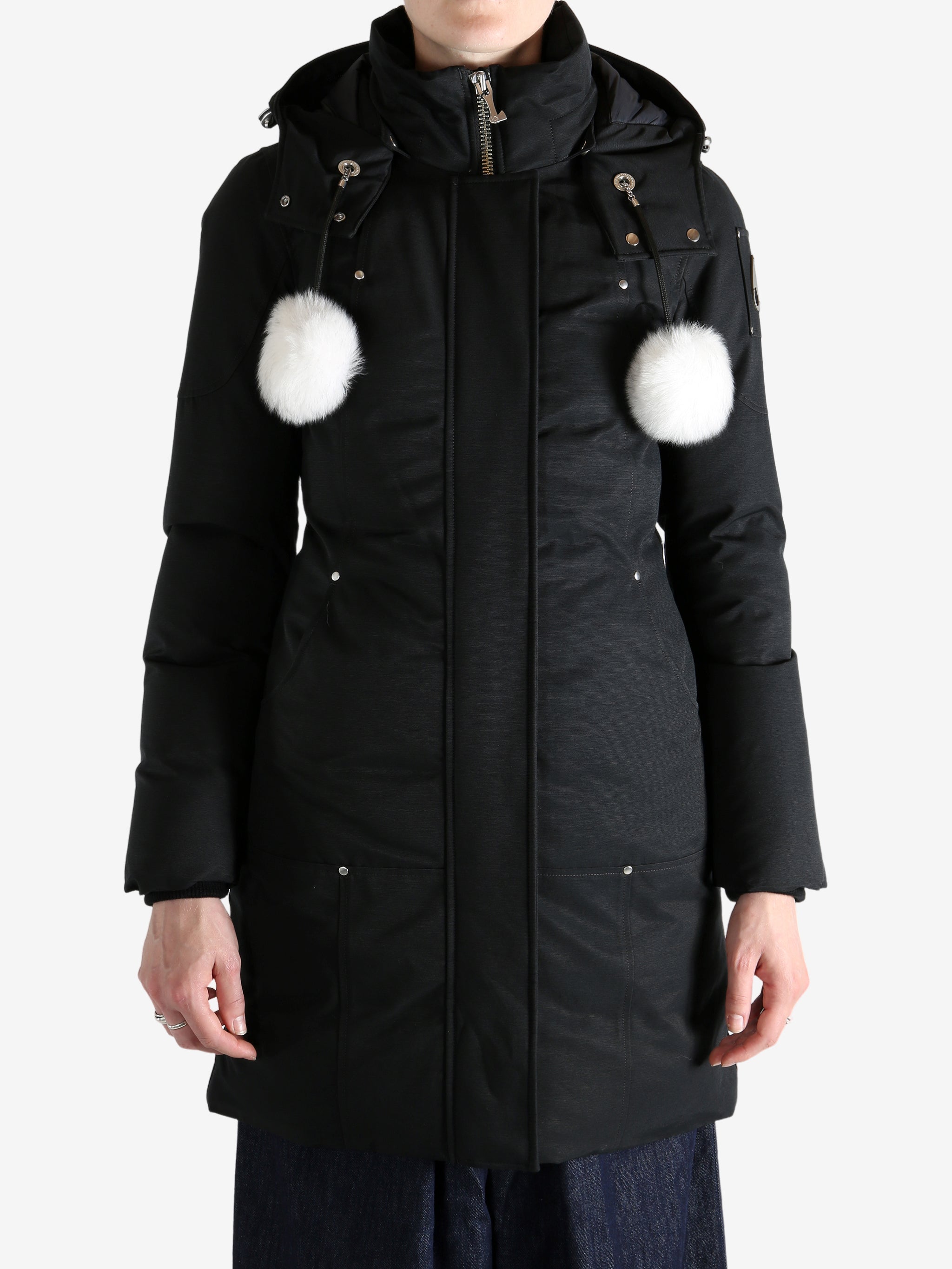 Black jacket worn by a person, showing the jacket fit