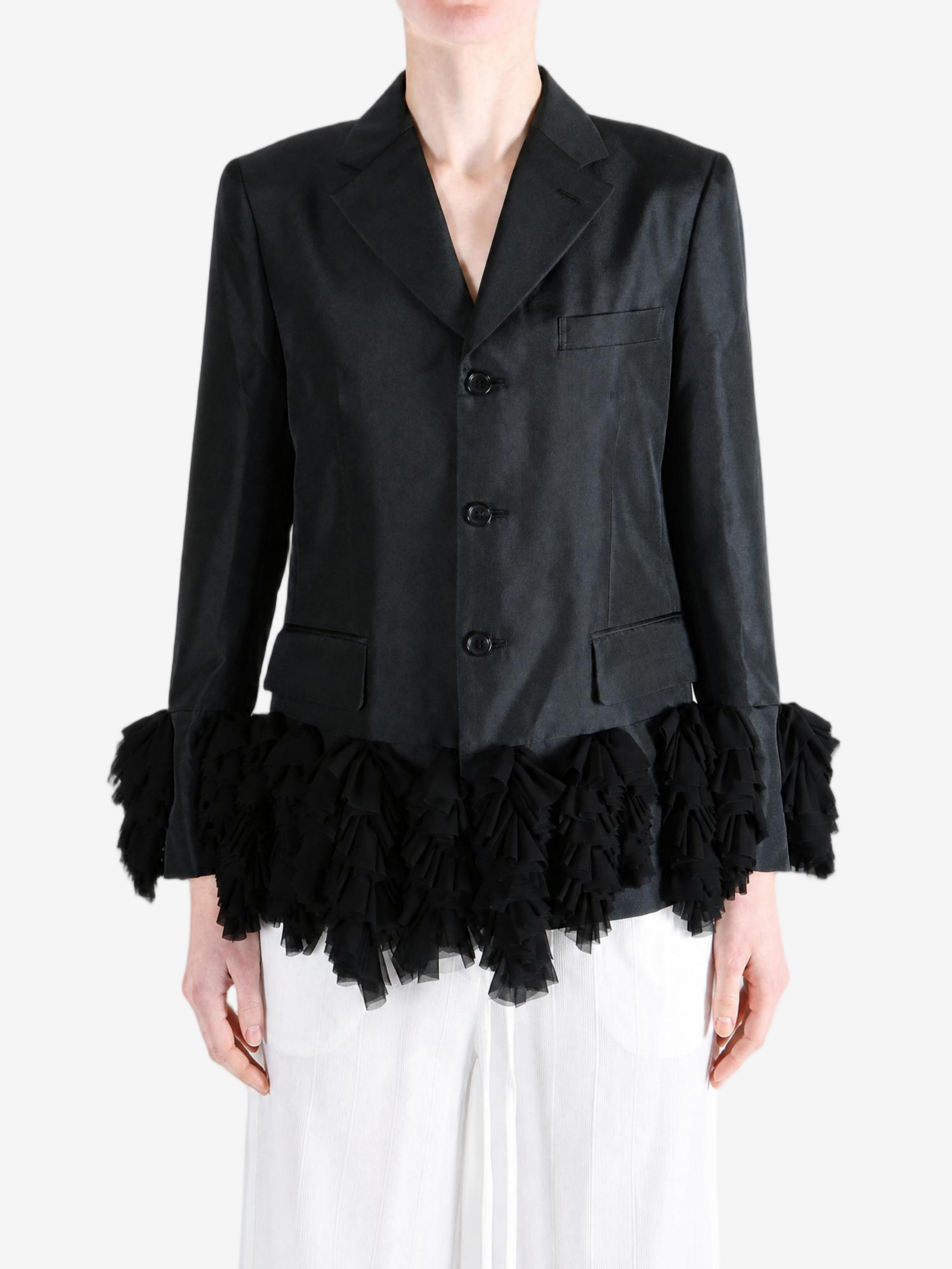 Black jacket worn by a person, showing the jacket fit