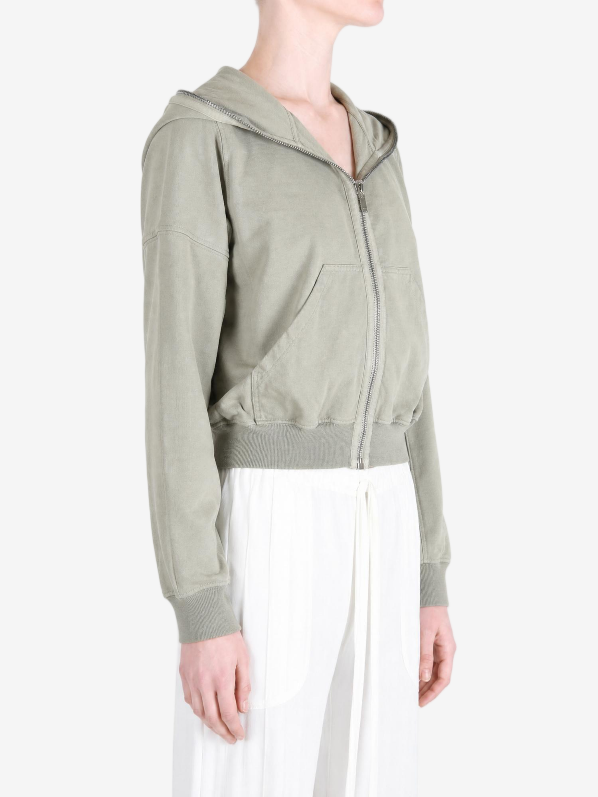 Green hoodie worn by a person, showing the hoodie fit